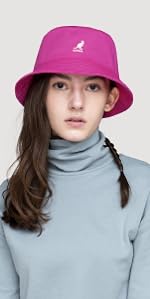 A woman wearing a pink Washed Bucket Hat. 